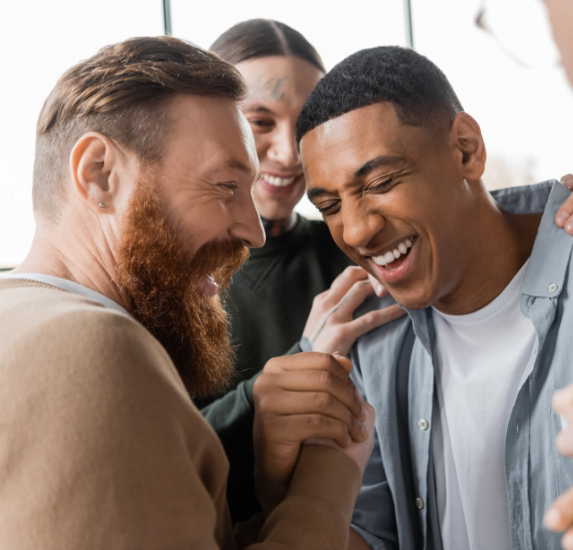 Three friends laughing together